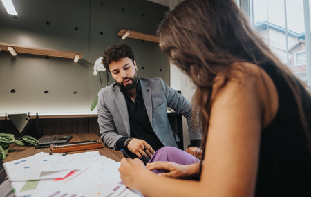 Business colleagues discuss project strategies during a meeting in a modern office