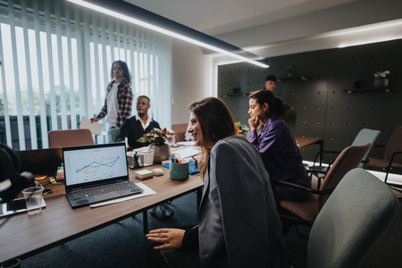 Diverse team of young entrepreneurs engaged in a business meeting in a modern office