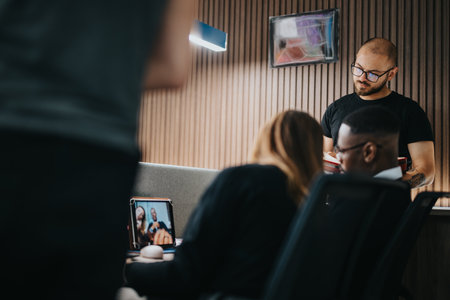 Diverse team of business professionals engaged in a discussion at workplaceの写真素材