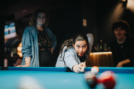 Group of friends playing pool in a bar, enjoying a fun night out together