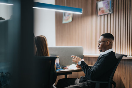 Business professional engaged in a meeting with colleagues in a modern office