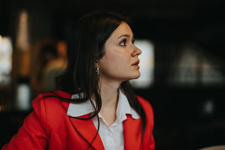 Young business entrepreneur in a meeting wearing a red blazerの写真素材