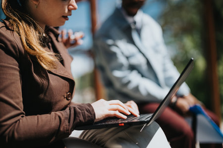 Multiracial business team collaborates outdoors in an urban settingの写真素材