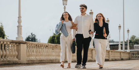 Business colleagues walking outside on a sunny day