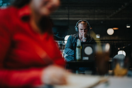 Young business entrepreneurs working in a modern workspace with a focused atmosphereの写真素材