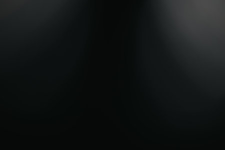Abstract dark background with subtle light gradients for artistic and design applications