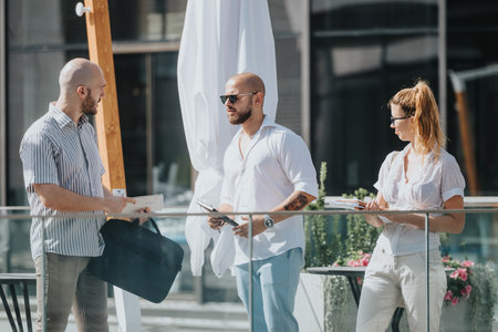 Team of marketing workers in an outdoor meeting discussing campaign performance, market trends and...