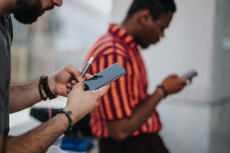 Business people collaborating in urban city environment using mobile technology