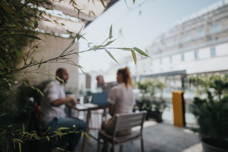 Young business entrepreneurs strategizing in an outdoor meeting, discussing project for growthの写真素材