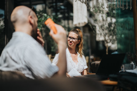 Startup team in business meeting discussing, brainstorming, analyzing and strategizing ideas outdoorsの写真素材