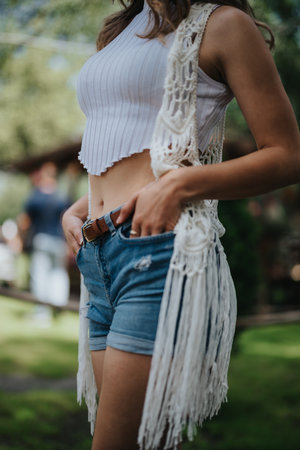 Young woman in casual summer outfit at ranch setting outdoors