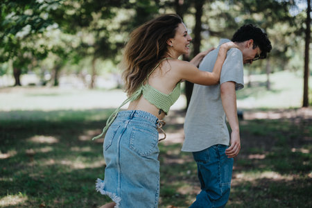 Young teenagers having fun in the park showcasing friendship and joyの写真素材