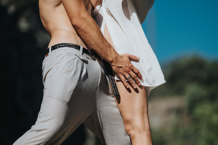 Close-up of intimate couple outdoors showcasing affection and connection in sunlightの写真素材