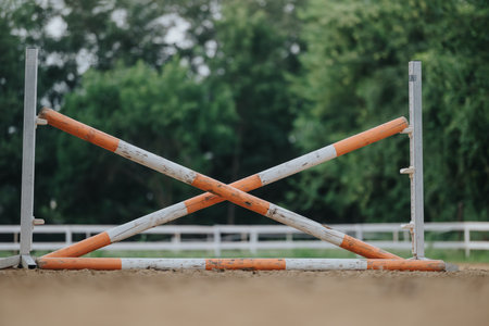 Close-up of an empty horse jump obstacle in an outdoor equestrian arenaの写真素材