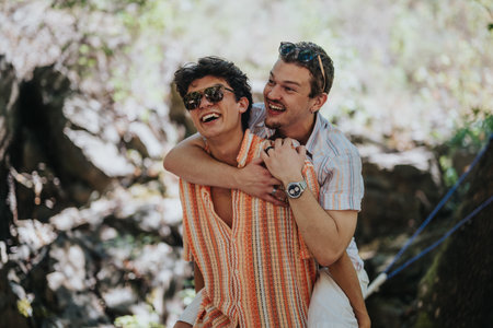 Joyful friends enjoying a playful moment outdoors in nature