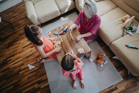 Family bonding time with children playing at home togetherの写真素材