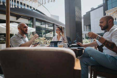 Startup team in business meeting discussing strategy at outdoor cafeの写真素材