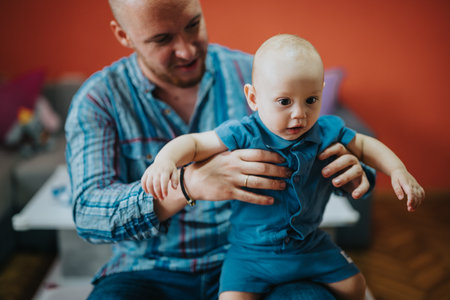 Father bonding with baby at home in casual setting