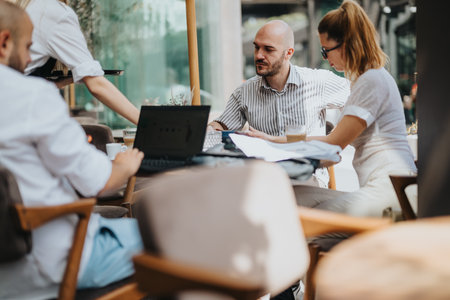Startup team in business meeting discussing, brainstorming, and strategizing collaborativelyの写真素材