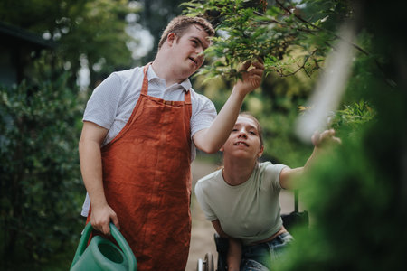 Young people nurturing plants in a serene garden settingの写真素材