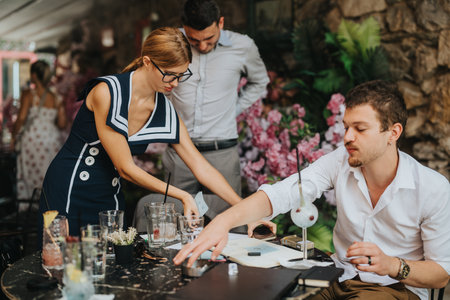 Group of young professionals collaborating at a trendy cafeの写真素材