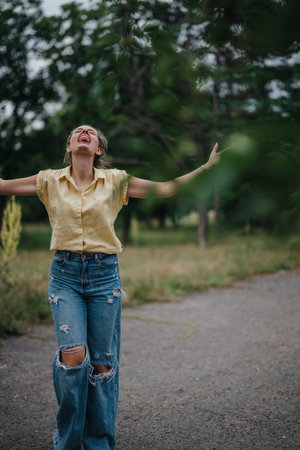 Young girl enjoying a carefree moment alone in the park