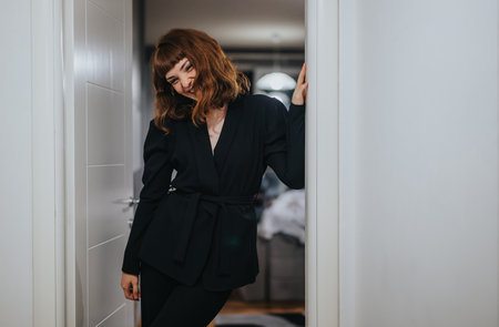Young woman getting ready for a fun night out in stylish outfit
