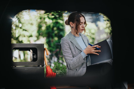 Young business associate brainstorming new project ideas during a meeting in an urban city areaの写真素材