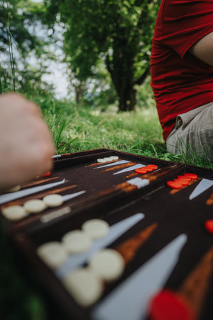 Backgammon game outdoors on a sunny day in the parkの写真素材