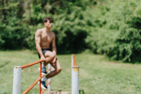 Fit strong male sports person working out in park on a sunny dayの写真素材