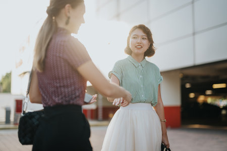 Multicultural business team discussing project in outdoor settingの写真素材