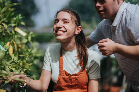 Joyful friends exploring a lush green garden togetherの写真素材