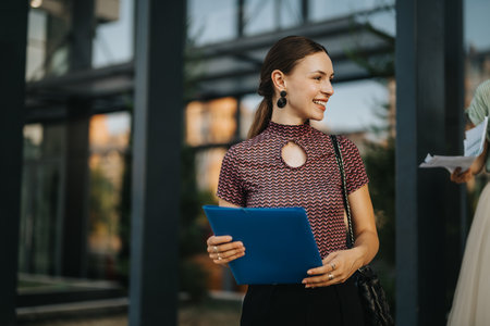 Young woman smiling outside during a business meeting