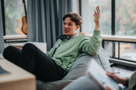 Professor discussing ideas with students in a cozy classroom settingの写真素材