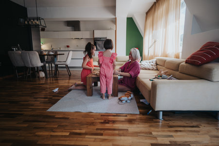 Family bonding time in cozy modern living room settingの写真素材