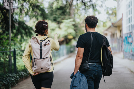 Students and professor walking outdoors during a casual campus outingの写真素材