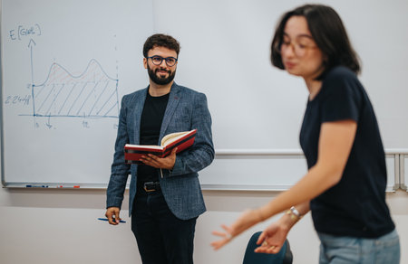 Teacher engaging with students in a dynamic classroom settingの写真素材