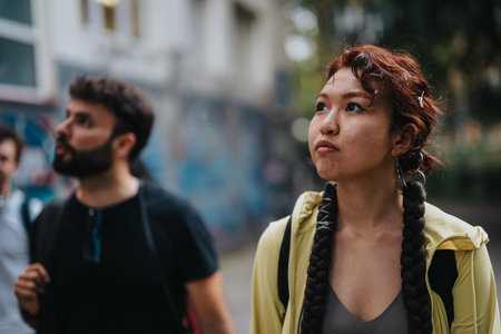 Students and professor having a conversation in an urban settingの写真素材