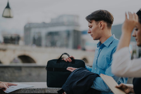 Business people meeting in lively urban city setting outdoorsの写真素材