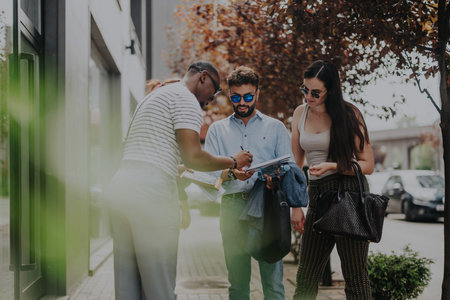 Group of business people discussing in an outdoor urban settingの写真素材