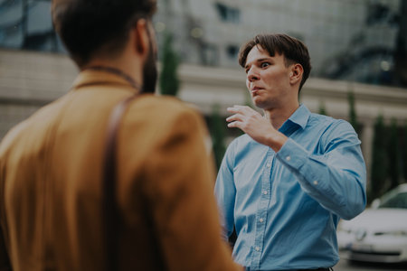 Two business people having a discussion in an urban environmentの写真素材