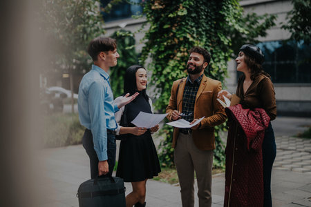 Business professionals in lively discussion outdoors during a work meeting