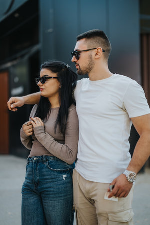 Casual couple walking together in urban street setting