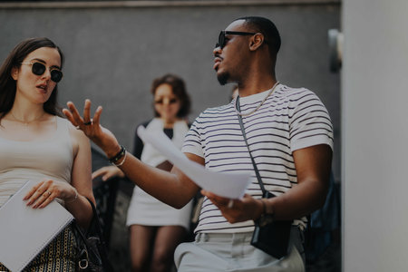 Business people engaged in outdoor team discussionの写真素材
