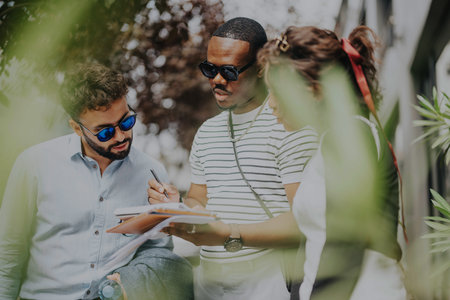 Business people collaborating outdoors in a natural settingの写真素材
