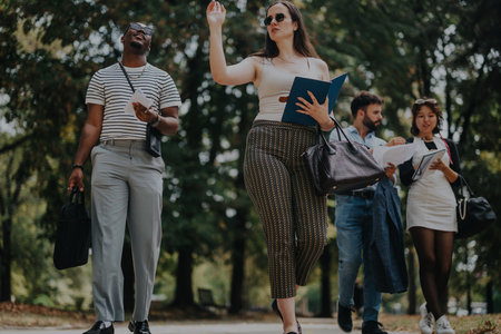 Group of business people enjoying a walk in the parkの写真素材