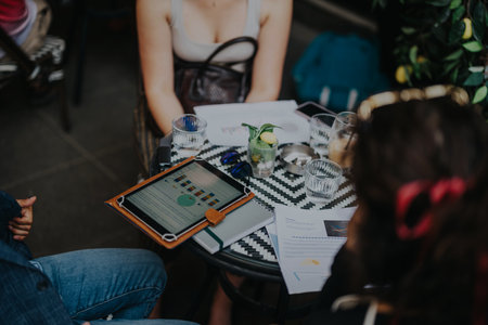 Group of multicultural businesspeople engage in a dynamic meeting, brainstorming strategies in a...