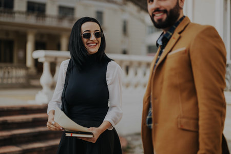 Smiling business people having a meeting in urban cityの写真素材