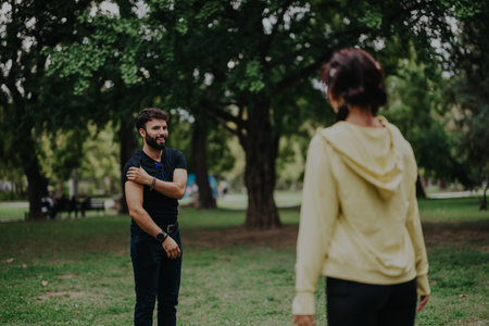 Students enjoy an outdoor sports class in a sunny park settingの写真素材