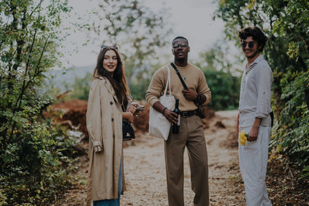Three friends enjoying a relaxing day in nature togetherの写真素材